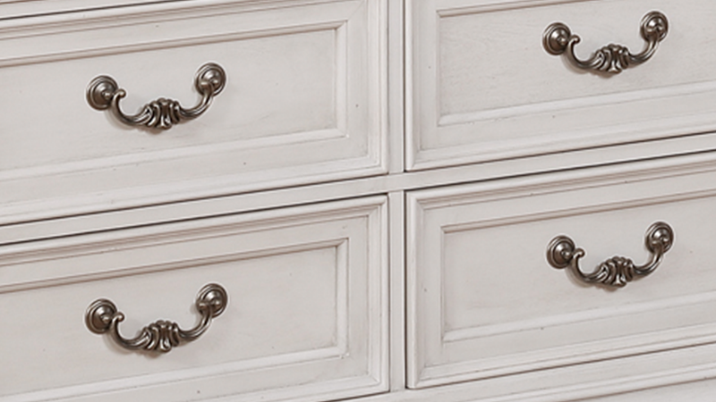 Close Up of the Drawer Pulls on the White Keystone TV Stand at an Angle | Home Furniture Plus Mattress