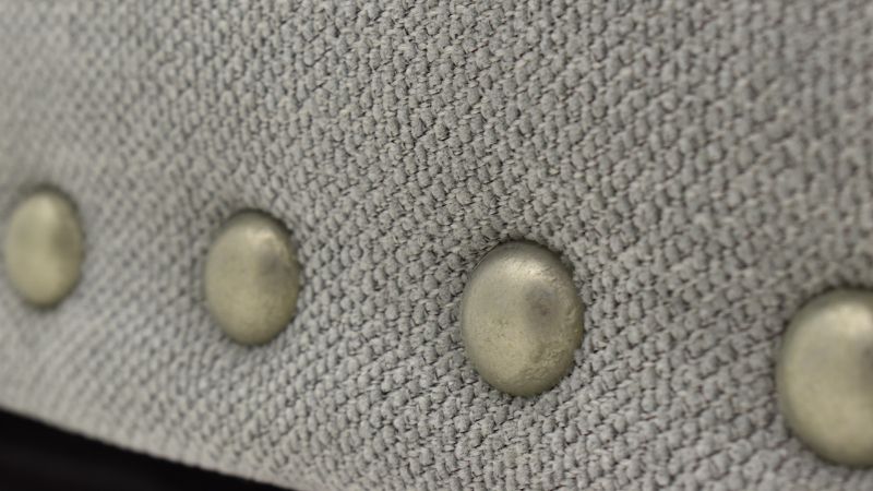 Close Up View of  the Nailhead Trim on the Cutler Loveseat in Gray by Jackson Furniture | Home Furniture Plus Bedding