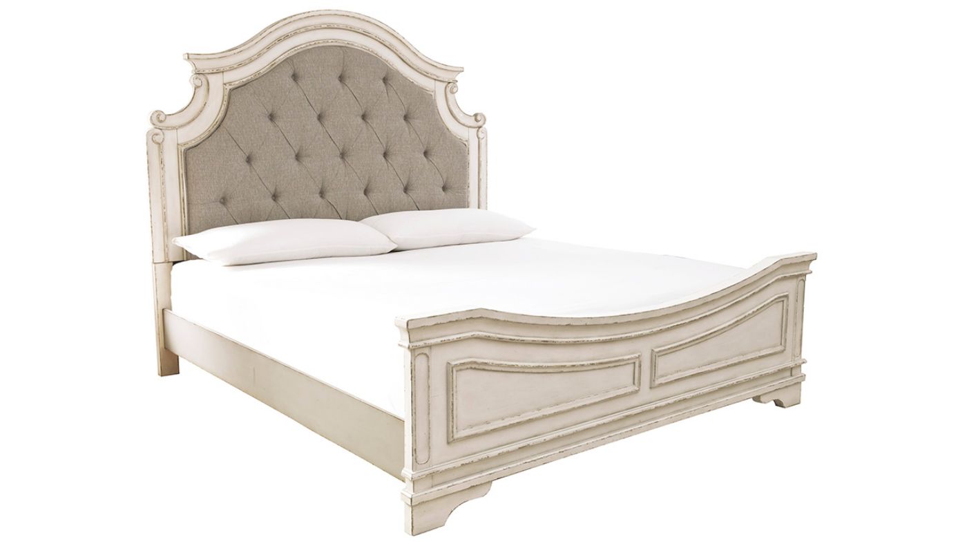 Slightly Angled View of the Realyn Queen Upholstered Panel Bed in Off White by Ashley Furniture | Home Furniture Plus Bedding