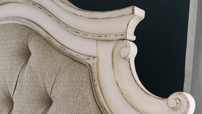 Close Up View of the Detailing on the Headboard of the Realyn Queen Upholstered Panel Bed in Off White by Ashley Furniture | Home Furniture Plus Bedding