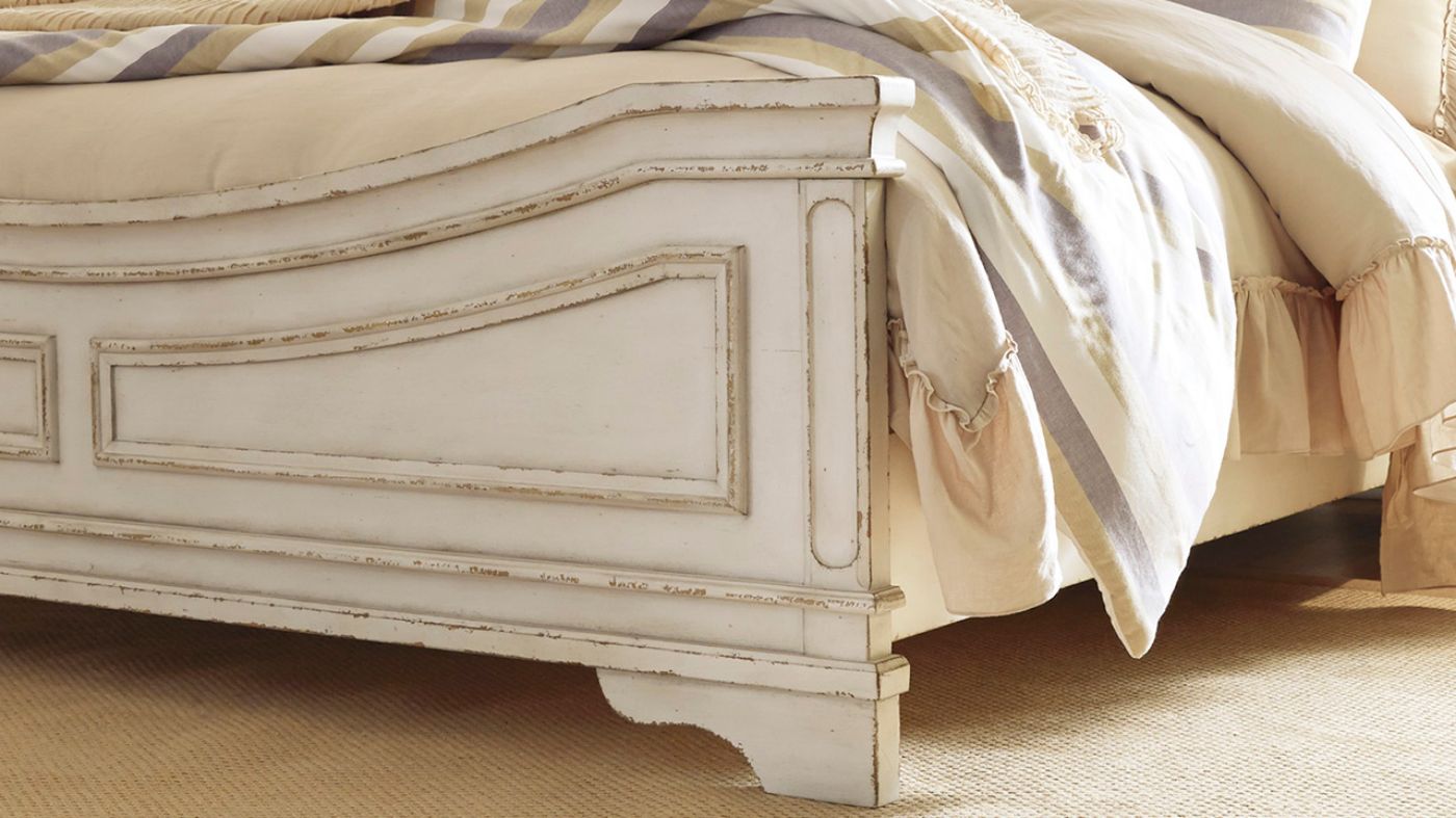 Close Up View of the Footboard on the Realyn Queen Upholstered Panel Bed in Off White by Ashley Furniture | Home Furniture Plus Bedding