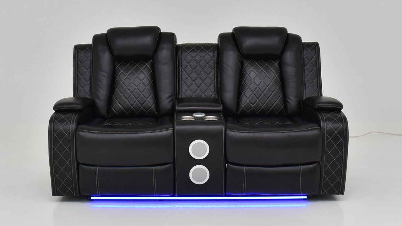 Lighted Front Facing View of the Orion Reclining Loveseat in Black by New Classic | Home Furniture Plus Bedding