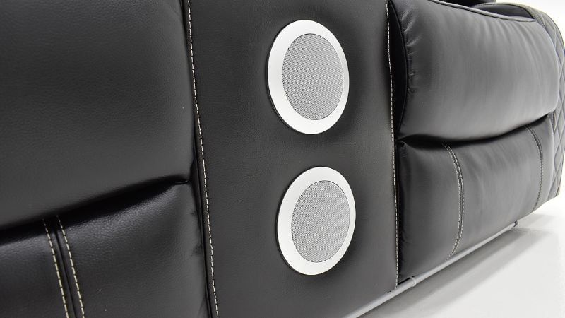 View of the Bluetooth Speakers on the Orion Reclining Loveseat in Black by New Classic | Home Furniture Plus Bedding
