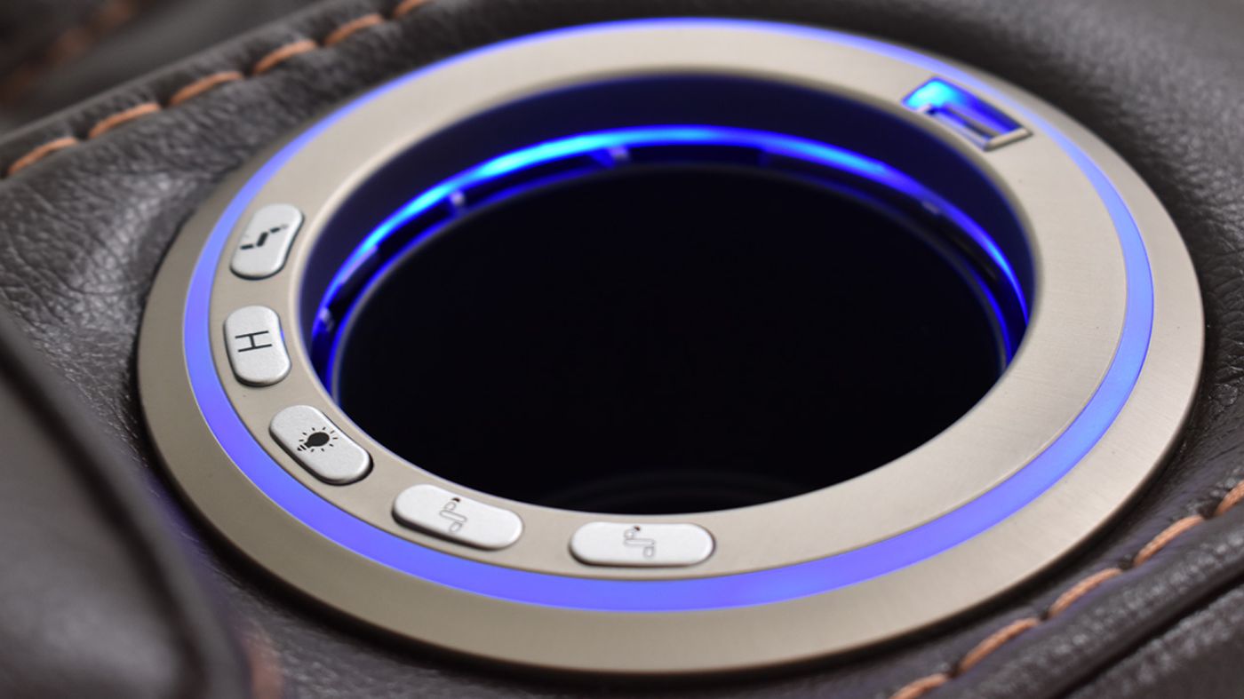 Close Up View of the Cupholders on the Milan POWER Reclining Loveseat with Lights in Brown by Man Wah | Home Furniture Plus Bedding