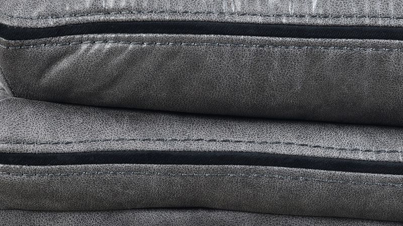 Close Up View of the Stitching on the Linville Glider Recliner in Gray by New Classic | Home Furniture Plus Bedding