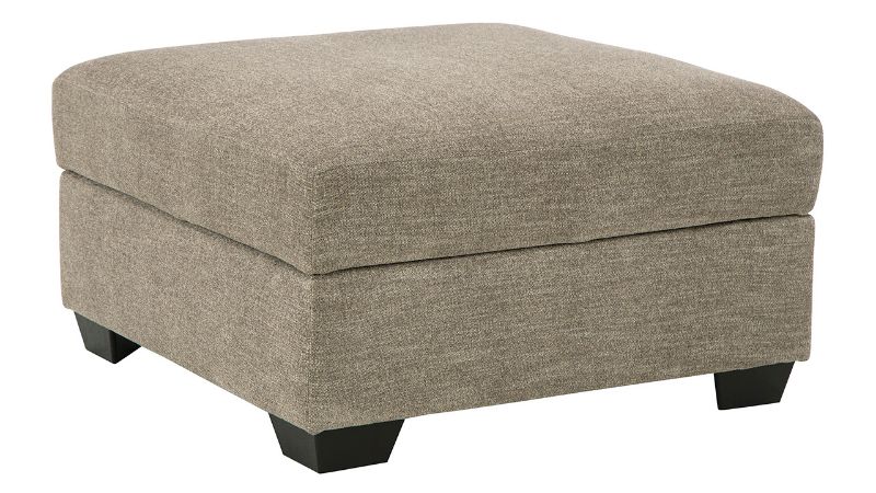 Slightly Angled View  of the Creswell Storage Ottoman in Stone Gray by Ashley | Home Furniture Plus Bedding