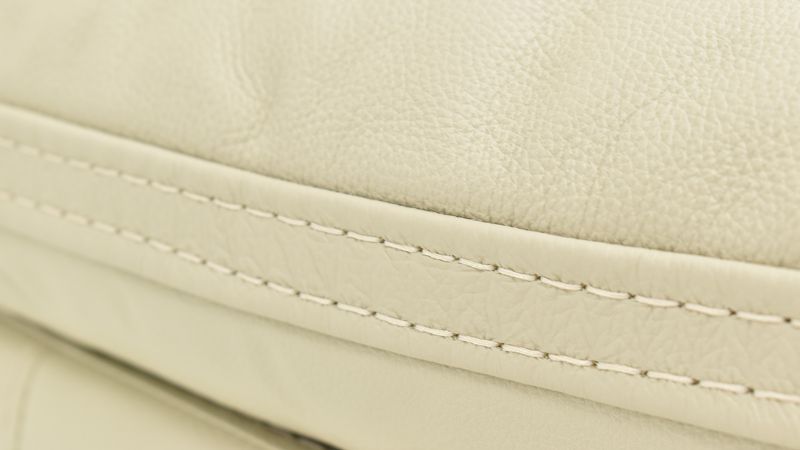 Close Up of the Stitching  Detail on the Dove POWER Reclining Sofa in Off White by Man Wah | Home Furniture Plus Bedding
