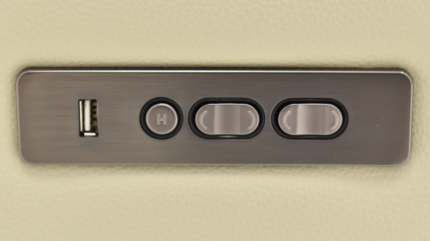 Close Up of the Power Controls on the Dove POWER Reclining Sofa in Off White by Man Wah | Home Furniture Plus Bedding