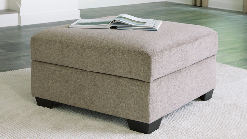 Room View of the Creswell Storage Ottoman in Stone Gray by Ashley Furniture | Home Furniture Plus Bedding