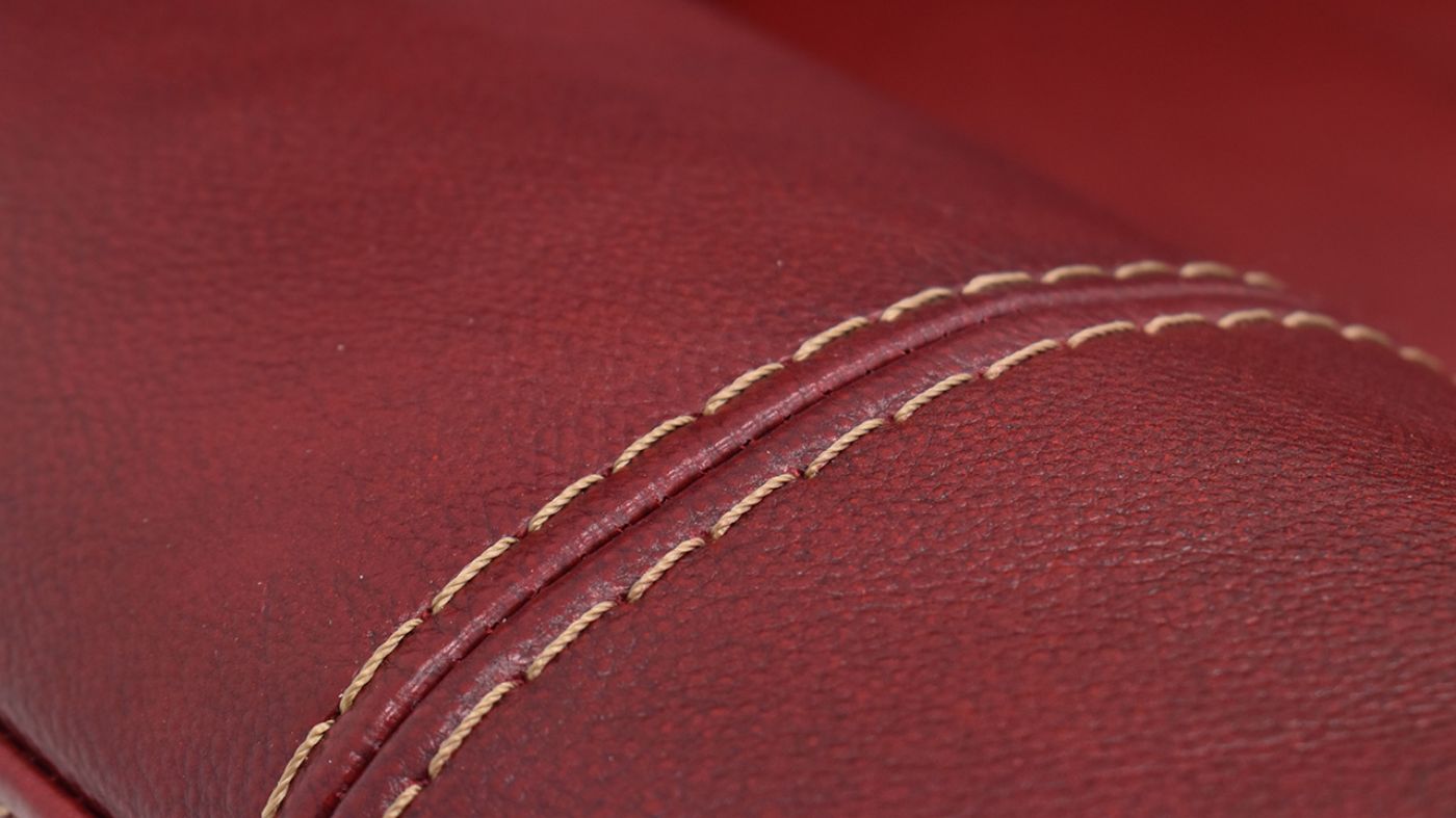 Close Up View of the Mercury POWER Reclining  Leather Sofa in Merlot Red by HomeStretch | Home Furniture Plus Bedding