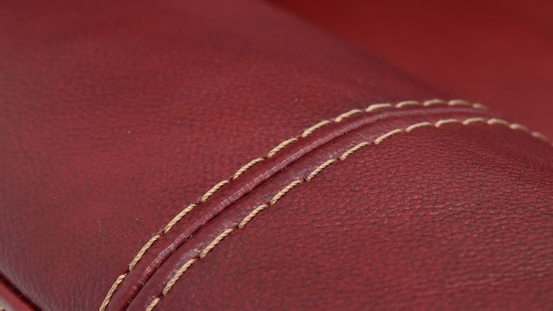 Close Up View of the Mercury Reclining Leather Sofa in Merlot Red by HomeStretch | Home Furniture Plus Bedding