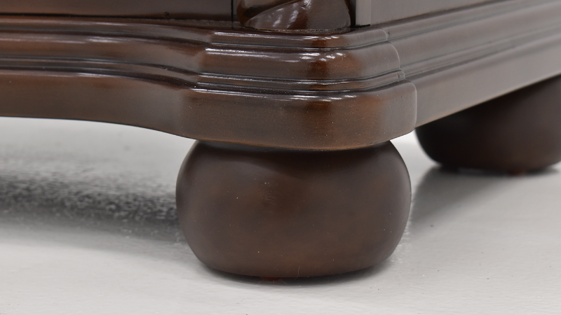 Close Up View of the Bottom Corner Foot on the Darren Media Chest of Drawers | Home Furniture Plus Bedding